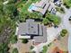 Birds eye view of home with lush landscaping, backyard patio and pool at 14 Marsh Ct, Ponce Inlet, FL 32127