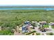 Aerial view of home and neighborhood by the river at 14 Marsh Ct, Ponce Inlet, FL 32127