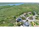 Aerial view of neighborhood and home in coastal community near river at 14 Marsh Ct, Ponce Inlet, FL 32127