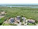 Aerial view of home, neighborhood, and river in the distance at 14 Marsh Ct, Ponce Inlet, FL 32127