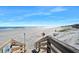 Beach access with boardwalk and railing leading to the sandy beach and ocean beyond at 14 Marsh Ct, Ponce Inlet, FL 32127