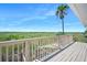 Private deck with stunning views of the natural marsh surroundings at 14 Marsh Ct, Ponce Inlet, FL 32127