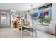 Cozy dining area with a round table next to a window, offering natural light at 14 Marsh Ct, Ponce Inlet, FL 32127