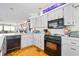 Clean kitchen featuring white cabinetry and modern appliances at 14 Marsh Ct, Ponce Inlet, FL 32127
