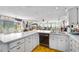 Kitchen showcases ample countertop space, white cabinets, and bright, natural light at 14 Marsh Ct, Ponce Inlet, FL 32127