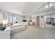 Spacious main bedroom with plush carpeting and access to a walk-in closet through the mirrored door at 14 Marsh Ct, Ponce Inlet, FL 32127