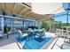 Inviting outdoor patio with seating, shaded canopy, and view of ocean at 14 Marsh Ct, Ponce Inlet, FL 32127
