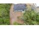 Aerial view of the home showing the roof, backyard and surrounding greenery at 1435 6Th Ave, Deland, FL 32724