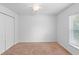 This bedroom features neutral walls, carpet, blinds, and a ceiling fan at 1435 6Th Ave, Deland, FL 32724