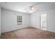 A bright bedroom features neutral walls and trim at 1435 6Th Ave, Deland, FL 32724