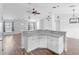 Open concept living space features a breakfast bar, modern ceiling fan, and neutral paint at 1435 6Th Ave, Deland, FL 32724