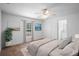 A bright main bedroom features neutral walls and trim with an ensuite bathroom at 1435 6Th Ave, Deland, FL 32724