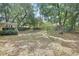 Expansive backyard with mature shade trees provides tranquil views at 1450 14Th St, Orange City, FL 32763