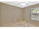 Bright bedroom with carpeted floors and a window offering natural light at 1450 14Th St, Orange City, FL 32763