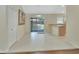 Dining area with tile flooring, sliding glass doors to the backyard, and adjacent breakfast bar at 1450 14Th St, Orange City, FL 32763