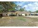 Charming single-Gathering home with lush landscaping and a welcoming entrance at 1450 14Th St, Orange City, FL 32763