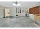 Spacious garage with workbench, water heater, and utility sink at 1450 14Th St, Orange City, FL 32763