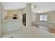Open kitchen area with a breakfast bar overlooking the living area and black appliances at 1450 14Th St, Orange City, FL 32763