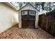 Backyard storage shed has double doors for easy access at 1450 14Th St, Orange City, FL 32763