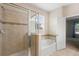 Bright bathroom with walk-in shower, garden tub, tile flooring, and neutral walls at 1480 Leitrim Loop, Apopka, FL 32703