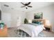 Comfortable bedroom featuring a ceiling fan, a double bed with bedside tables and artwork at 1480 Leitrim Loop, Apopka, FL 32703