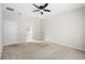 Neutral bedroom with large open door into the bathroom, carpeted floors, and white walls at 1480 Leitrim Loop, Apopka, FL 32703
