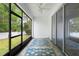Enclosed lanai with sliding doors and patterned carpet at 1480 Leitrim Loop, Apopka, FL 32703