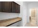 The laundry room features a granite countertop and cabinets for storage at 1480 Leitrim Loop, Apopka, FL 32703