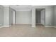 Neutral living room with gray walls, tile floors, crown molding, and recessed lighting at 1480 Leitrim Loop, Apopka, FL 32703