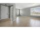 Inviting living room featuring large windows, neutral paint, and tile flooring at 1480 Leitrim Loop, Apopka, FL 32703