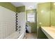 Bathroom featuring a tub/shower combo and a vanity needing repair at 1560 7Th Ave, Deland, FL 32724