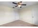 Bedroom featuring a ceiling fan, carpeted floor, and double door closet at 1560 7Th Ave, Deland, FL 32724