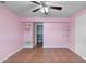 Bedroom with ceiling fan, large closet, and tiled flooring at 1560 7Th Ave, Deland, FL 32724