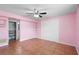 Bedroom with large closet, tiled flooring, and ceiling fan at 1560 7Th Ave, Deland, FL 32724