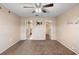 Spacious bedroom with ceiling fan, carpeted floors, and wall decorations at 1560 7Th Ave, Deland, FL 32724