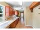 Kitchen with long countertops, backsplash, and tiled floors at 1560 7Th Ave, Deland, FL 32724