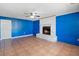 Spacious living room with fireplace, ceiling fan, and tile flooring at 1560 7Th Ave, Deland, FL 32724