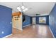 Open-concept living area with tiled floors and natural light from a front window at 1560 7Th Ave, Deland, FL 32724