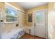 Mud Room features metal shelves, electrical panel, exterior door, and window at 1560 7Th Ave, Deland, FL 32724
