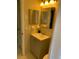 Compact bathroom with a single sink vanity and a framed mirror at 1626 S Page Dr, Deltona, FL 32725