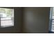 Bedroom featuring windows providing natural light and neutral wall paint at 1626 S Page Dr, Deltona, FL 32725