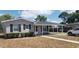 Charming single-story home featuring a covered front porch and well-maintained landscaping at 1626 S Page Dr, Deltona, FL 32725