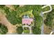 Stunning aerial view of a home with a red tile roof, pool, manicured landscaping, and mature trees at 1641 Timber Hills Dr, Deland, FL 32724