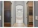 Hall view of bathroom with modern freestanding tub, glass shower, and separate walk-in closets at 1641 Timber Hills Dr, Deland, FL 32724