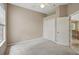 Neutral bedroom with a ceiling fan, plush carpet, closet, and a doorway to another room at 1641 Timber Hills Dr, Deland, FL 32724