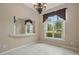 Bright dining room with tile floors, neutral walls, a chandelier, and a large window with views of the outdoors at 1641 Timber Hills Dr, Deland, FL 32724