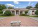 Beautiful single-story home with a red tile roof, white exterior, and manicured front yard at 1641 Timber Hills Dr, Deland, FL 32724