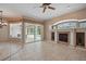 Spacious living room features tile floors, fireplace, sliding glass doors with pool view, and natural light at 1641 Timber Hills Dr, Deland, FL 32724