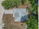 Aerial view of house showing the roof, driveway, and surrounding trees at 1890 15Th St, Orange City, FL 32763