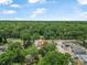 Aerial view of property surrounded by trees at 1890 15Th St, Orange City, FL 32763